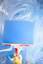 Cleaning window with squeegee blue sky Royalty Free Stock Photo