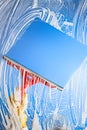 Cleaning window with squeegee blue sky Royalty Free Stock Photo