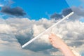 Cleaning window with squeegee to clean the sky Royalty Free Stock Photo