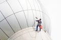 Cleaning windows service on high rise building. it is dangerous Royalty Free Stock Photo