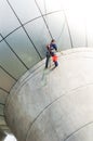 Cleaning windows service on high rise building. it is dangerous Royalty Free Stock Photo