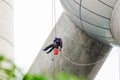 Cleaning windows service on high rise building. it is dangerous Royalty Free Stock Photo