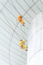 Cleaning windows service on high rise building. it is dangerous Royalty Free Stock Photo