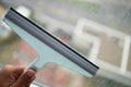 Cleaning windows with a squeegee. Royalty Free Stock Photo