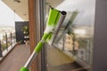 Cleaning windows with a squeegee. Royalty Free Stock Photo