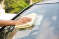 Cleaning windshield car with microfiber cloth