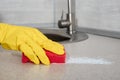 Cleaning. woman gloves hands cleaning kitchen. Cleaning home table, sanitizing kitchen table, surface with red sponge. Deep Royalty Free Stock Photo