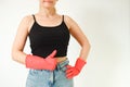 Cleaning woman with red rubber gloves on a white background. Red glove for cleaning on a female hand shows thumb up Royalty Free Stock Photo