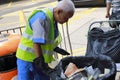 Cleaning worker of fehd clean up trash can