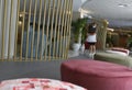 A cleaning worker wearing protective mask scrub the floor of a hotel wider