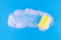 Cleaning yellow sponge and a soapy bubble foam on a blue background. Cleaning concept, cleaning service. Banner. Flat lay, top