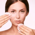 Cleansing face wasing tonic. Demakeup. remove mascara. Cotton pad hand Royalty Free Stock Photo