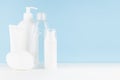 Cleansing and skin care cosmetics bottles, lotions mockup in elegant soft light white and blue bathroom interior on tableÃÅ½ Royalty Free Stock Photo