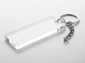 Clear acrylic keychain with silver charm - isolated on white background Royalty Free Stock Photo