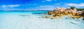 Clear amazing azure coloured sea water with granite rocks in Capriccioli beach, Sardinia, Italy