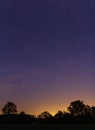 Clear autumn night sky with stars and tree silhouette. Czech landscape Royalty Free Stock Photo