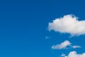 Clear azure blue sky background with group of romantic puffy white clouds