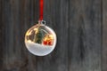 Clear Ball Ornament with christmas tree and small gift Royalty Free Stock Photo