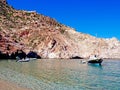 A clear bay and the lighthouse of Polyaigos, an island of the Greek Cyclades