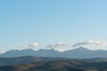 clear blue air over mountains in bulgaria crops hay fields clouds blue sharp focus distance superzoom copy space for text minimal Royalty Free Stock Photo