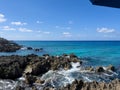 The clear blue ocean off of turtle reef in Cayman Islands on a beautiful blue sky day Royalty Free Stock Photo