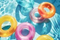 Clear blue pool dotted with playful floaties, conjuring images of warm, lazy summer days Royalty Free Stock Photo