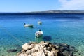 The lovely blue sea and boats between Brela and Baska Voda in Dalmatia, Croatia