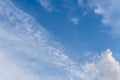 Wispy Cirrus Clouds in a Bright Blue Sky Background Royalty Free Stock Photo
