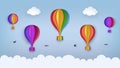 Clear blue sky with clouds, flying birds, rainbow-colored hot air balloons. Swallows flying in the sky. Paper craft summer scene.