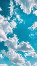 Clear blue sky dotted with light, fluffy white clouds Royalty Free Stock Photo