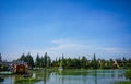 A clear blue sky with green lake water and forest as background in indonesia Royalty Free Stock Photo