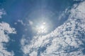 Clear blue sky with partly cloudy and sun in the middle Royalty Free Stock Photo