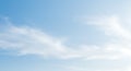 Clear blue sky with soft, wispy clouds gently stretched across the frame. The Royalty Free Stock Photo