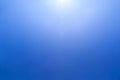 Clear blue sky the sun shines from the top creating beautiful flares. With a copy space to put text on Royalty Free Stock Photo