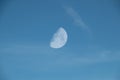 Clear Blue Sky with Whispy Faint Clouds and Faint Half Moon