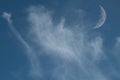 Clear Blue Sky with Whispy Faint Clouds and a sickle Moon