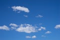 Clear blue sky with white clouds background