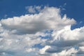 The clear blue sky with white clouds, closeup / Very fine weather with stratocumulus and cumulus clouds on a summer day. Royalty Free Stock Photo