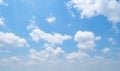 Clear blue sky with white fluffy clouds at noon. Day time. Abstract nature landscape background Royalty Free Stock Photo