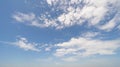 Clear blue sky with white fluffy clouds at noon. Day time. Abstract nature landscape background Royalty Free Stock Photo