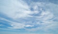 Clear blue sky with white fluffy clouds at noon. Day time. Abstract nature landscape background Royalty Free Stock Photo