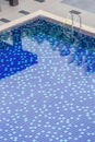 Clear blue swimming pool and shadow reflected on surface water, Royalty Free Stock Photo