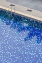 Clear blue swimming pool and trees shadow reflected on surface w Royalty Free Stock Photo