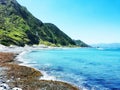 Clear Blue Water Against The Cliffs