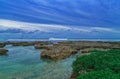 Clear blue water with corals and beautiful sky at beach for surfers Cloud9, Siargao Island, the Philippines. Royalty Free Stock Photo