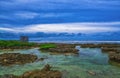 Clear blue water with corals and beautiful sky at beach for surfers Cloud9, Siargao Island, the Philippines. Royalty Free Stock Photo