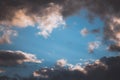 Clear Bluish Sky, Shining by the Sun, in the Middle of a Cloudy Sky. Hope, Optimism. Copy space. Background Royalty Free Stock Photo