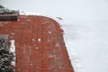 Sidewalk path partially cleared of snow