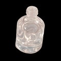 Clear Bottle Filled With Water on a Plain Surface Under Bright Light Royalty Free Stock Photo