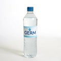 Bottle of water with \'Germ\' text isolated on white background Royalty Free Stock Photo